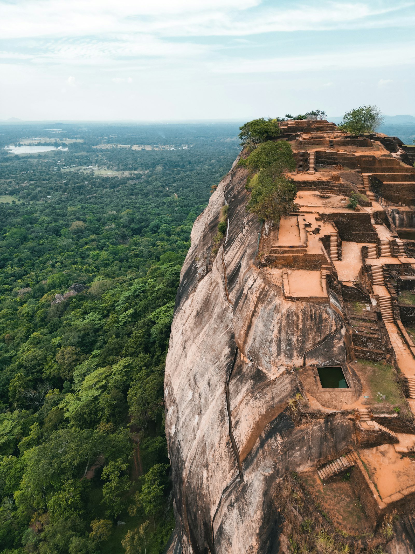 Sigiriya rock above green countryside